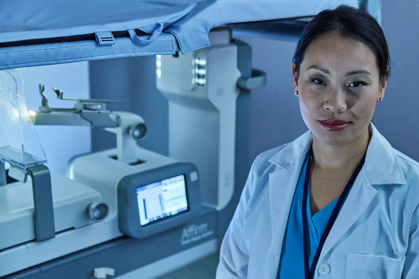 Healthcare professional in front of Breast Biopsy System